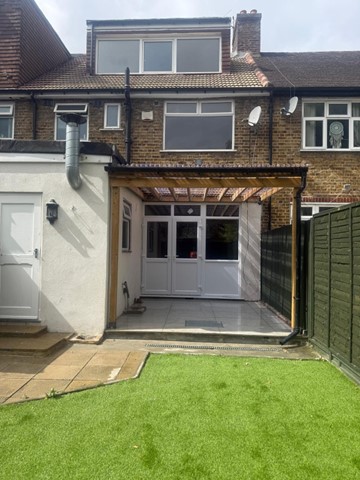 Rear of property with covered patio
